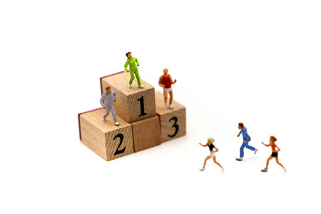 Miniature people : marathon runners with wooden block of number, jogging and running,healthy lifestyle and sport concepts.の写真素材