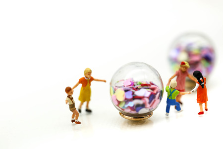 Miniature people : children,students with Colorful of candies and lollipops,education and food concept.の写真素材