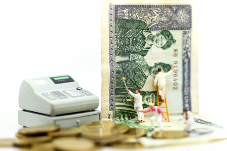 Miniature people: Workers brush painting dollar, Business financial and investment concept.