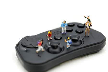 Miniature people student and children with joystick,Play and learn concept.