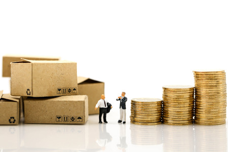 Miniature people : Businessman and Worker and box with stack of coins shipping, rent container, business concept.の写真素材