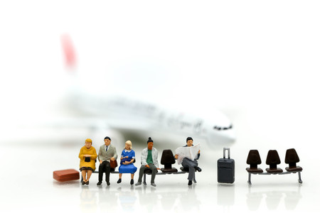 Miniature people : businessman waiting for a taxi in front of the airport,business meeting concept.の写真素材