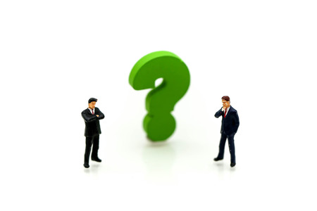 Miniature people : Businessman with THE QUESTION MARK using for concept Punctuation Dayの写真素材