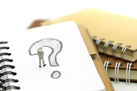 Miniature people : Businessman with THE QUESTION MARK using for concept Punctuation Dayの写真素材
