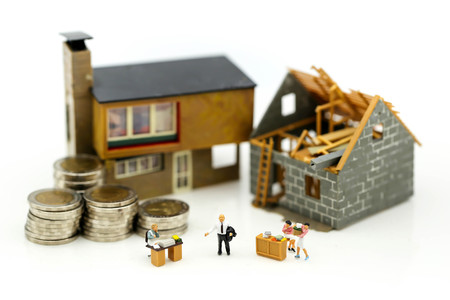 Miniature people : Business meeting with coins stack and home renovating,Business planning and Financial Concept.の写真素材