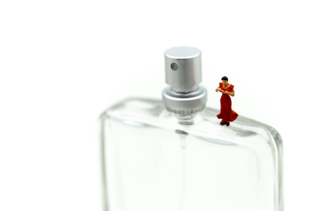 Miniature people: Women and friend with perfume spray,cosmetic, beautiful concept.の写真素材