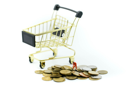 Miniature people : worker digging on coins ,Money, Financial, Business Growth concept.の写真素材