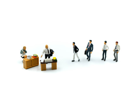 Miniature people : Buisnessman to interview of office using for concept Job Action Day.の写真素材