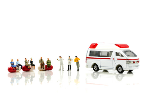 Miniature people : Doctor with patient in medical office with worker take Piill capsules,Health care concept.の写真素材