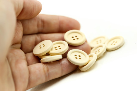 Buttons for clothes on white background using for concept of Button Day.