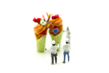Miniature people : Chef is decorating ice cream with mint and strawberry,cherry,snackの写真素材
