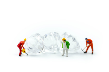 Miniature people : working cutting diamond ,  Diamond cutters concept.の写真素材