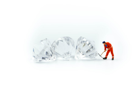 Miniature people : working cutting diamond ,  Diamond cutters concept.