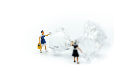 Miniature people : Maid or Housewife cleaning on diamond.の写真素材