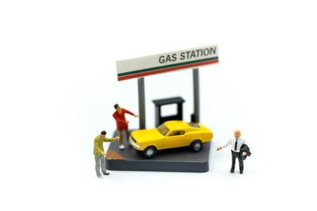 Businessman On Gas Station with coins, business gas station economy concept.の写真素材