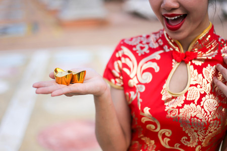 Portrait of a beautiful Asian Woman hold with luck money and red pocket,chinese new year concept.の写真素材