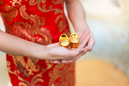 Portrait of a beautiful Asian Woman hold with luck money and red pocket,chinese new year concept.の写真素材