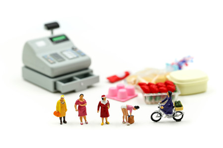 Miniature people : housewife enjoying in shopping at market. Lifestyle, consumerism, shoppingの写真素材