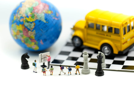 Miniature people : student and children with chess,Education competition concept.の写真素材