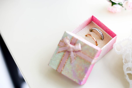Wedding background for weddings accessorie and two golden rings.