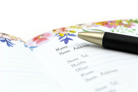 Writing the name on a paper with a pen using for concept of Namesake day.の写真素材