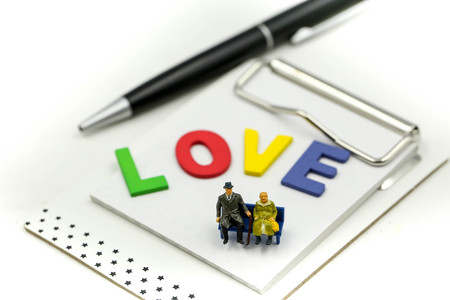 Miniature people : Loving  couple relaxing enjoying feelings togetherness, romantic morning pleasure for lovers at home,Couple Appreciation concept.の写真素材