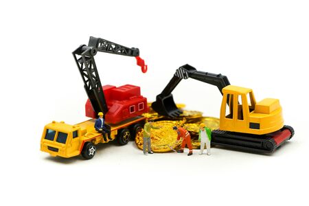 Miniature people : worker digging on coins,Money, Financial, Business Growth concept.の写真素材