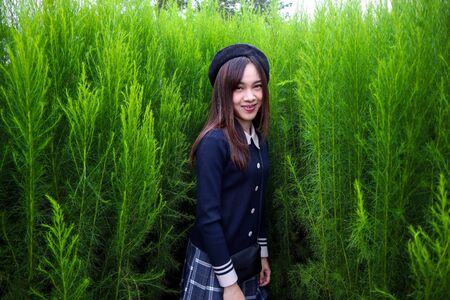 Portrait of a young beautiful woman Asian in gardenの写真素材