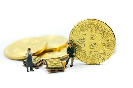 Miniature people : miner Worker Man  digging Bitcoin on whiteの写真素材