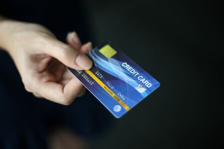 Closeup of credit card hold by handの写真素材