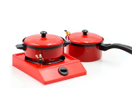 Miniature people : Maid or Housewife cleaning and  Cook chef in kitchen interior with kitchenware
