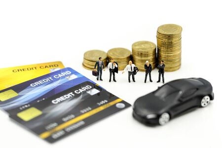 Miniature people : Businessman with money creditcard  and car Business consultants on financial transactions for car loan concept.の写真素材