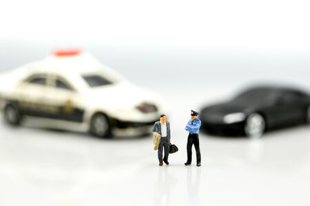 Miniature people : Police officer emergency service car driving street,car crash accident damagedの写真素材