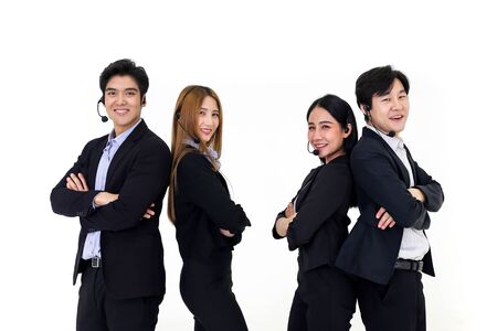 Asia Group of call center workers or Confident business team with headset standing on whiteの写真素材