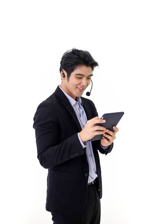 Asia call center workers or Confident business  with headset,Customer support standing on white background.の写真素材