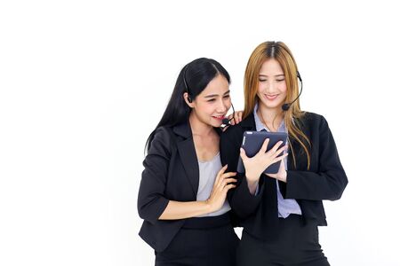 Couple Asia call center workers or Confident business  with headset,Customer support standing on white background.の写真素材
