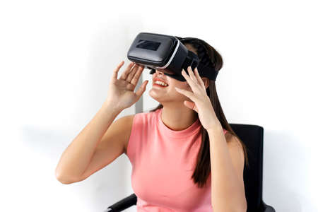 Happy beautiful asia women playing video games virtual reality glasses.の写真素材
