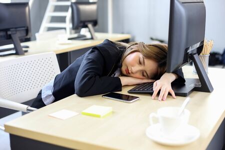 Beautiful asian woman working hard women fall sleep at officeの写真素材