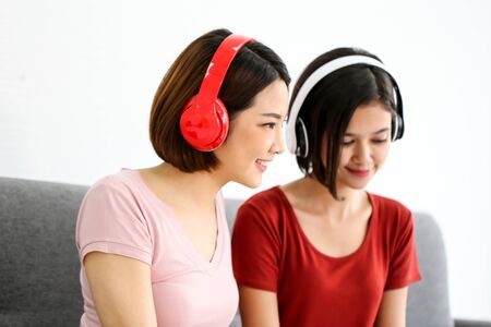 Happy Couple  asia woman wearing headphones and enjoy musicの写真素材