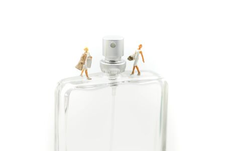 Miniature people : beautiful woman with bottle of perfume.の写真素材