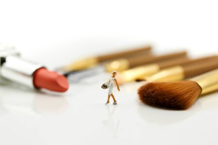 Miniature people : beautiful woman and Makeup products with cosmeticの写真素材