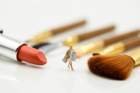 Miniature people : beautiful woman and Makeup products with cosmeticの写真素材