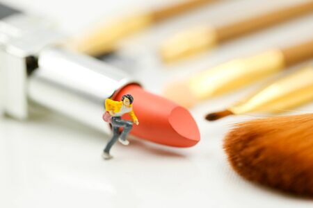 Miniature people : beautiful woman and Makeup products with cosmeticの写真素材