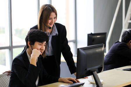Asia Group of call center workers or Confident business team with headset in office.の写真素材