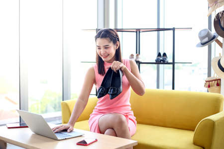 Asian woman beauty blogger or vlogger review ,designer shopping online with hand holding credit card show,Concept Promotion and Sale.の写真素材