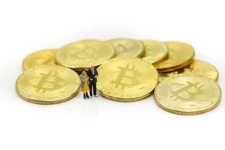 Miniature people : Old people Cryptocurrency Bitcoin coins virtual money will growth up in the future bitcoin investment retirement and insurance conceptの写真素材