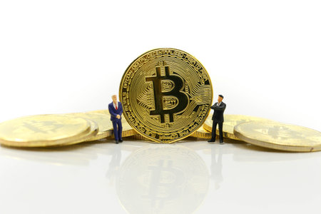 Miniature people : Old people Cryptocurrency Bitcoin coins virtual money will growth up in the future bitcoin investment retirement and insurance conceptの写真素材