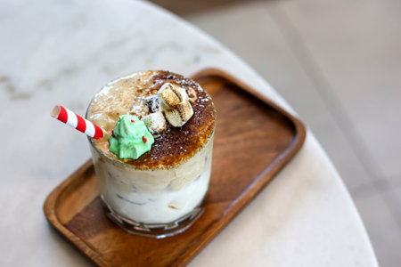 Milky Caramel drink with marshmallows and sugar Santa dolls.の写真素材