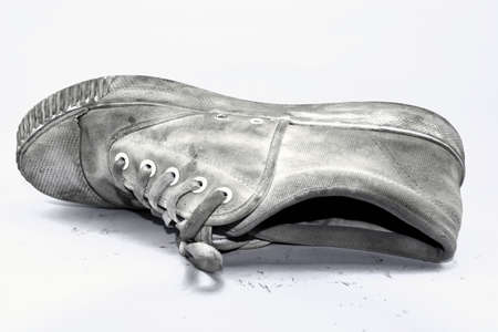 Shoes, old, unused, very dirty, smelly, and a black and white image.の写真素材