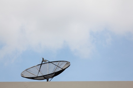 Old Satellite Dish On Top of The Buildingの写真素材